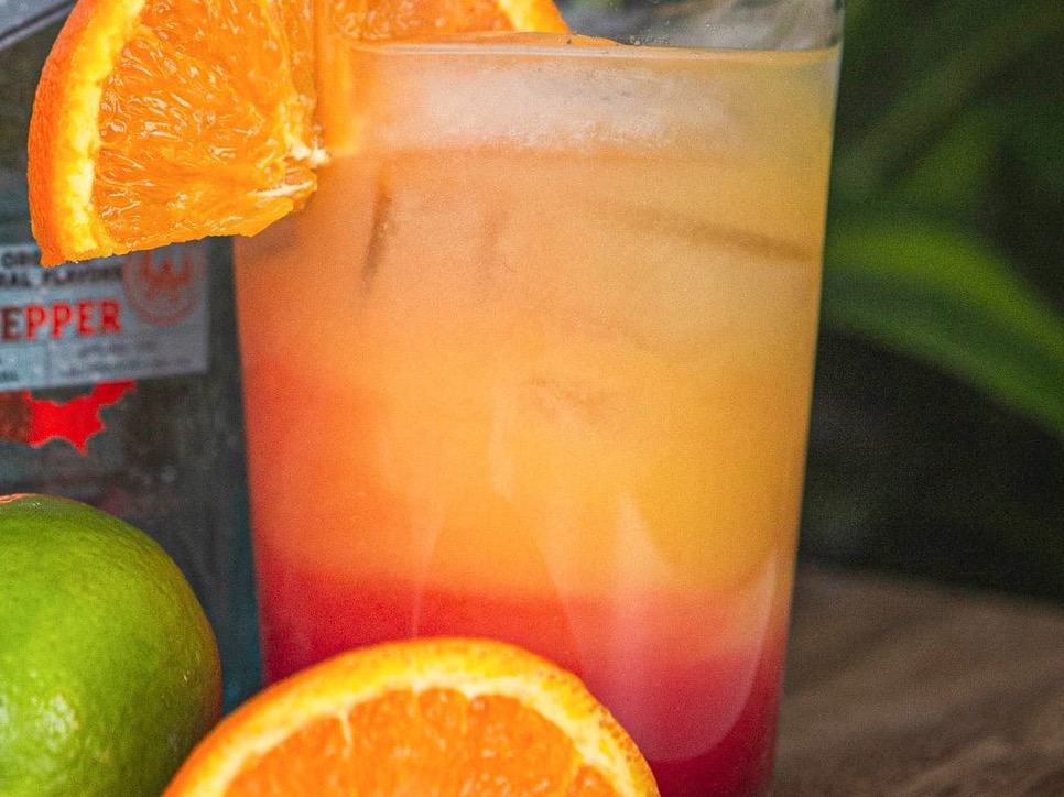 orange juice in clear drinking glass